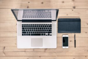 An image of a computer and a mobile device, either of which can be used to send a fax without a phone line.