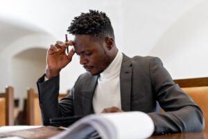 A man in a gray suit determining where to fax Form 2848 to the IRS.